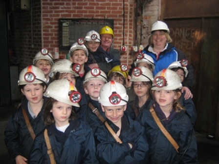 Photograph: Prep 3 pupils with teacher, Mrs Janet Clayton and their wonderful museum guide, just before heading down a mine shaft