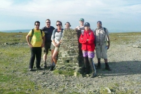 The group reach the summit of Ingleborough