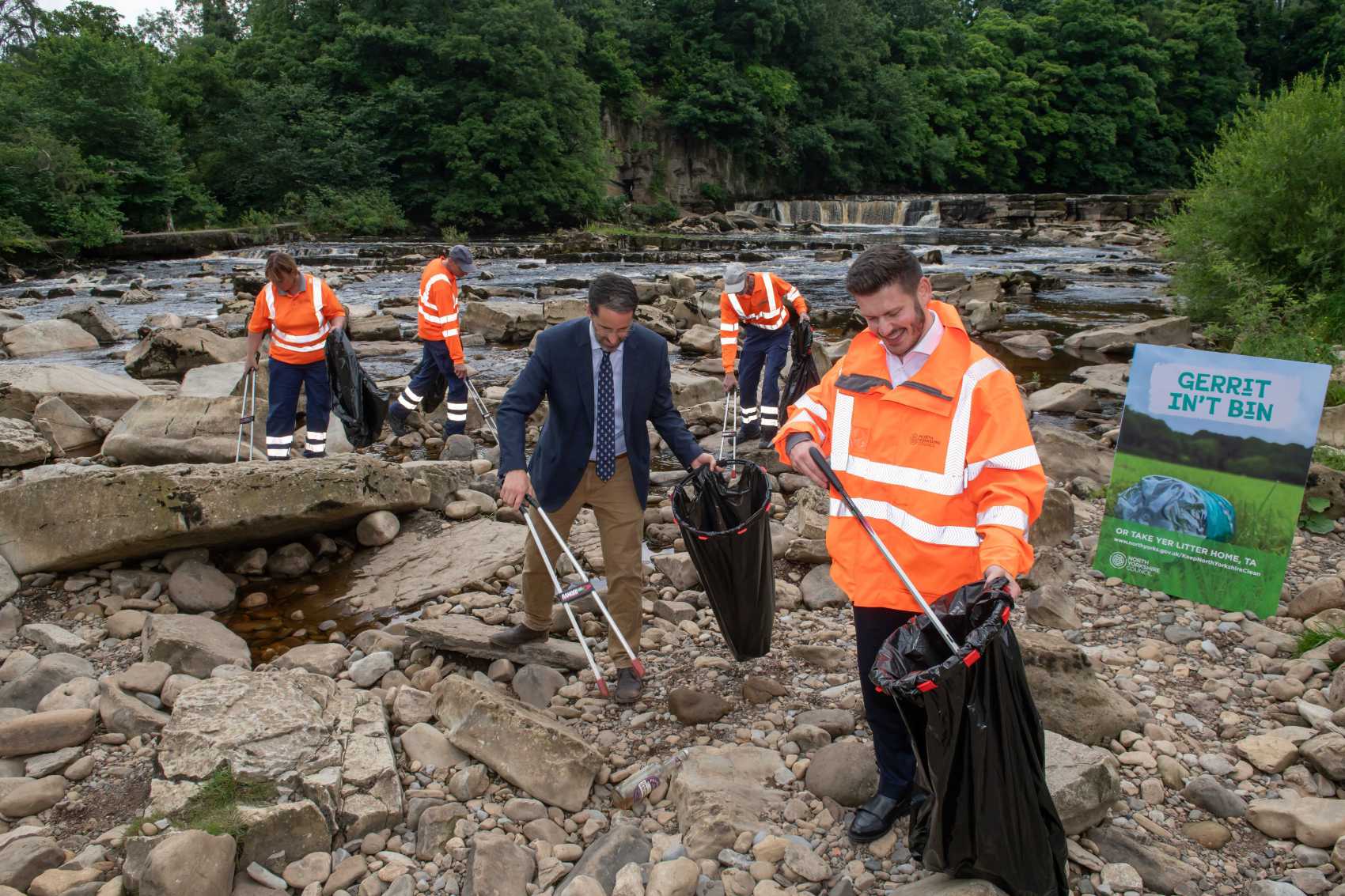 North Yorkshire Council’s executive member for street scene, Cllr Keane Duncan, with North Yorkshire Council’s assistant director for environment services, Michael Leah, at Richmond Falls along with members of North Yorkshire Council’s street scene team.