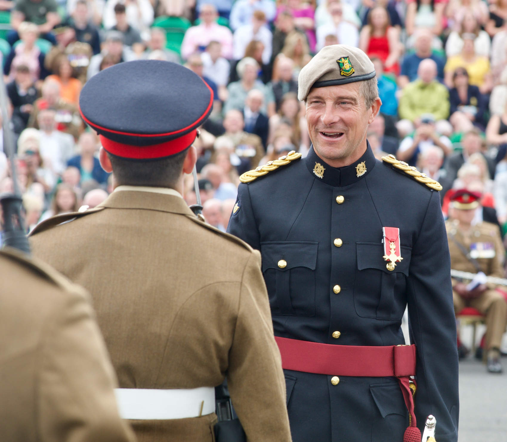 New Honorary Colonel Bear Grylls speaks with Junior Soldiers at AFC Harrogate Pass Out parade.