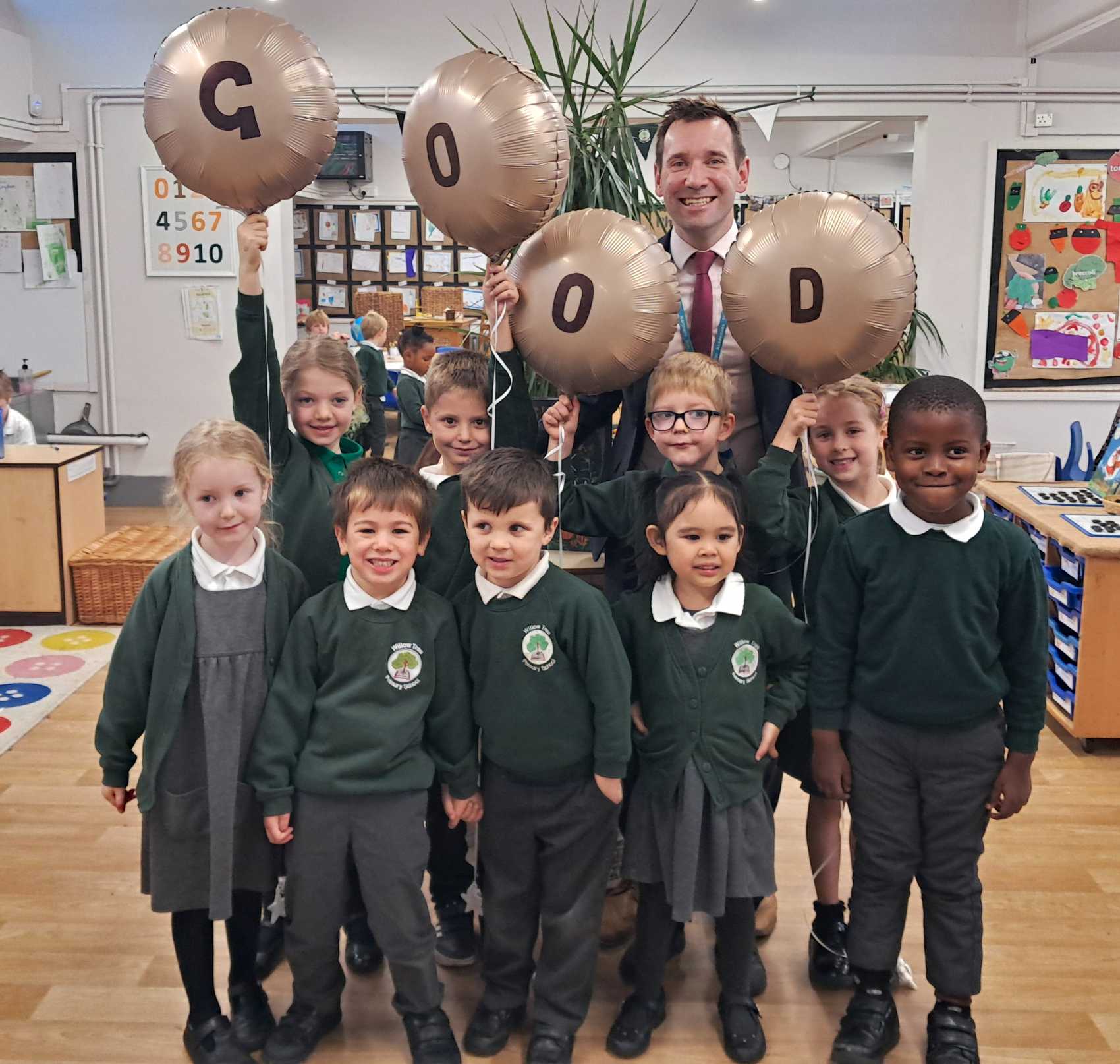 Willow Tree Primary School pupils and headteacher Mr Robert Mold celebrate receiving a “Good” rating from Ofsted