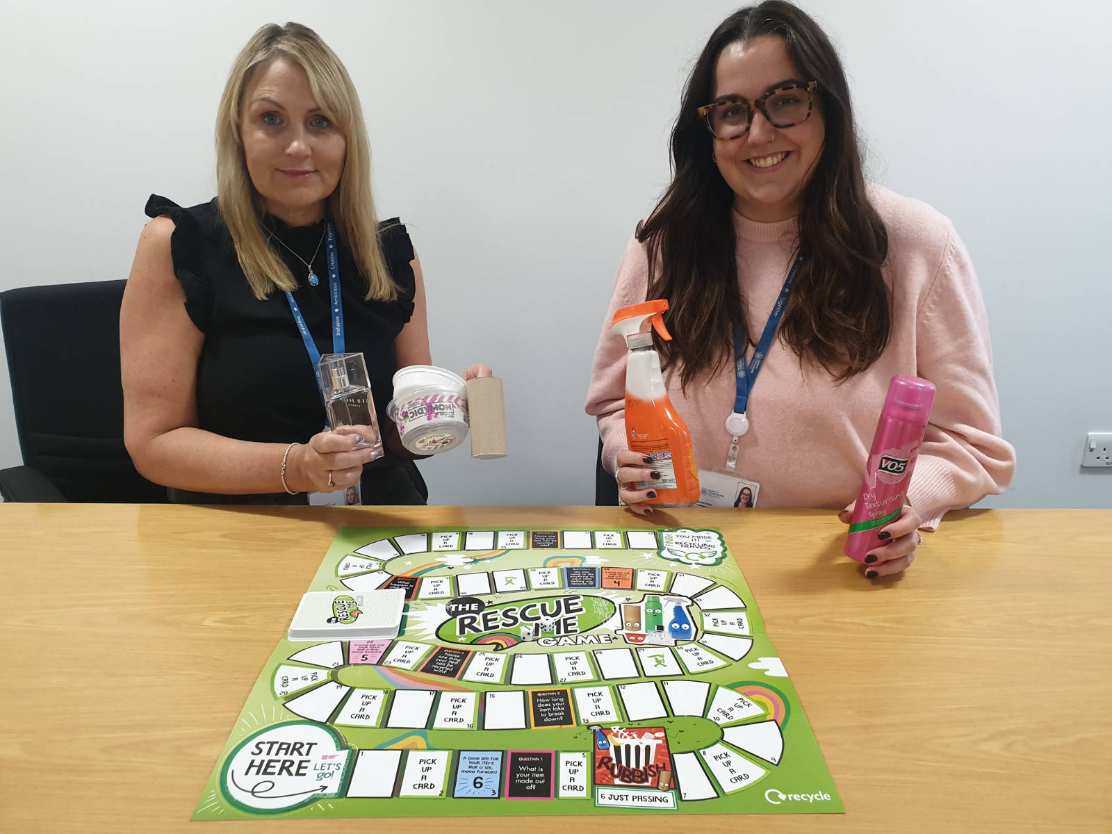 Michelle Bailes, left, and Ariane Heap get ready to introduce the boardgame to schools