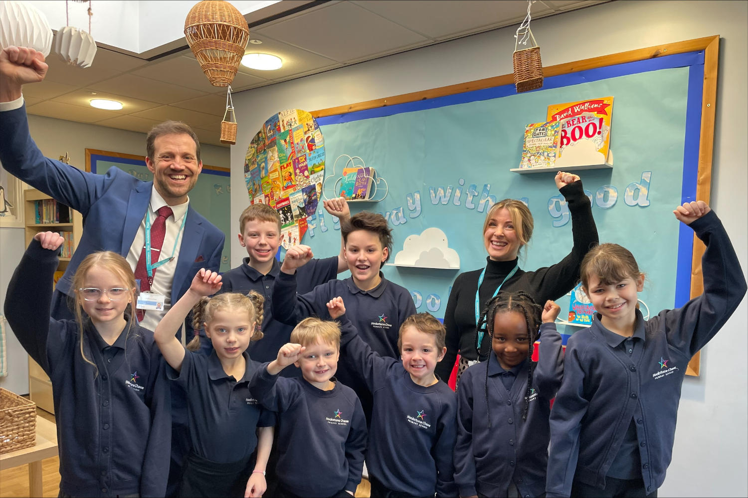 Headteacher Mr James Hughes, Deputy Headteacher Miss Hannah Norton and pupils from Hookstone chase Primary School celebrate their Ofsted success